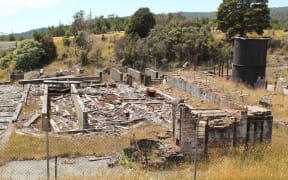 Remnants of mining activities amid grass
