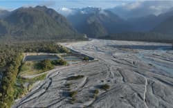 A view of the Waiho River avulsion, bottom left, with the Westland District Council’s Franz Josef wastewater treatment ponds immediately above, and now prone in the river bed.