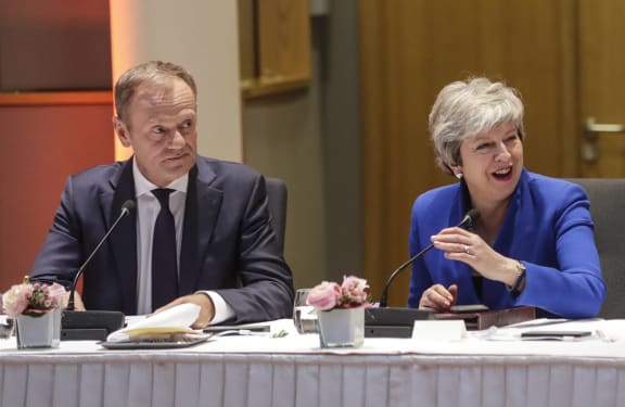 European Council President Donald Tusk (L) and Britain's Prime Minister Theresa May look on during a European Council meeting on Brexit at The Europa Building at The European Parliament in Brussels on April 10, 2019.
