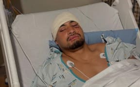 Melbourne Storm star Eli Katoa in the hospital following his injury after a test against New Zealand earlier this month.