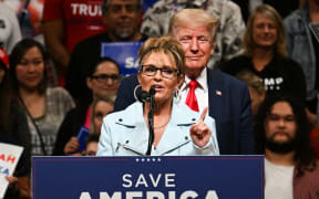 House of Representatives candidate Sarah Palin (left) speaks alongside former US President Donald Trump during a "Save America" rally in Anchorage, Alaska on 9 July, 2022. Former Alaska governor Sarah Palin on August 31, 2022 lost her bid to fill the state's vacant seat in the US House of Representatives.