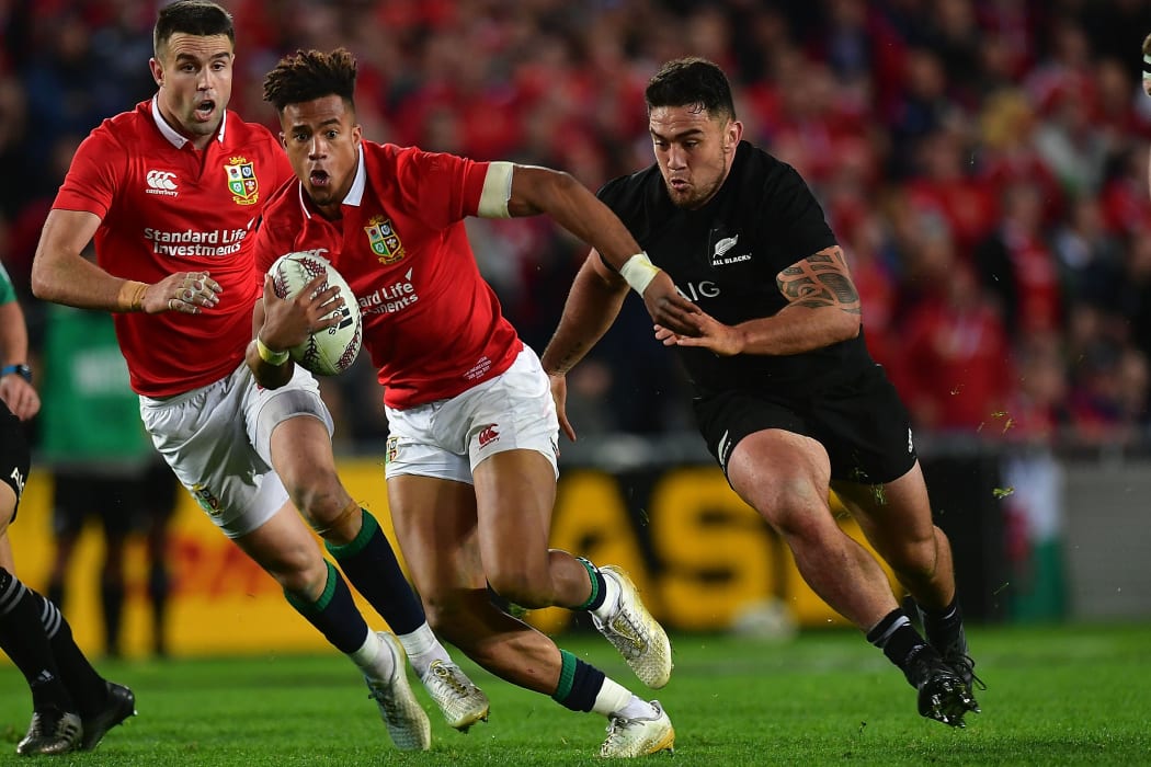Lion's Anthony Watson is tackled by All Blacks Codie Taylor during the All Blacks vs British and Irish Lions at Eden Park.