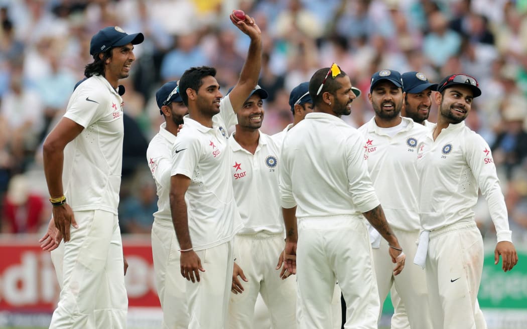 Indian cricketers celebrate.