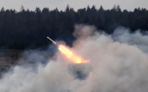 The TOS-1 Solntsepyok (Blazing Sun) multiple thermobaric rocket launcher shoots during a demonstration of its running and firing capabilities at the ARMY 2020 International Military and Technical Forum at the Patriot Park, in Alabino, Moscow region, Russia.