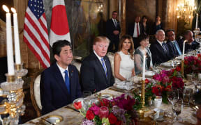 US President Donald Trump, First Lady Melania Trump, Japan's Prime Minister Shinzo Abe, and his wife Akie Abe take part in a dinner at Trump's Mar-a-Lago estate.