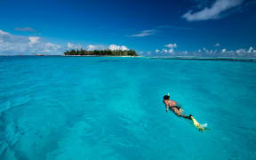 A snorkeler enjoys the waters of the CNMI