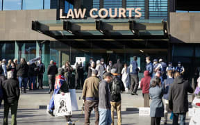 Anti-government protesters have gathered outside the entrance to Christchurch's Court buildings this morning as Counterspin Media hosts were due to appear in court.