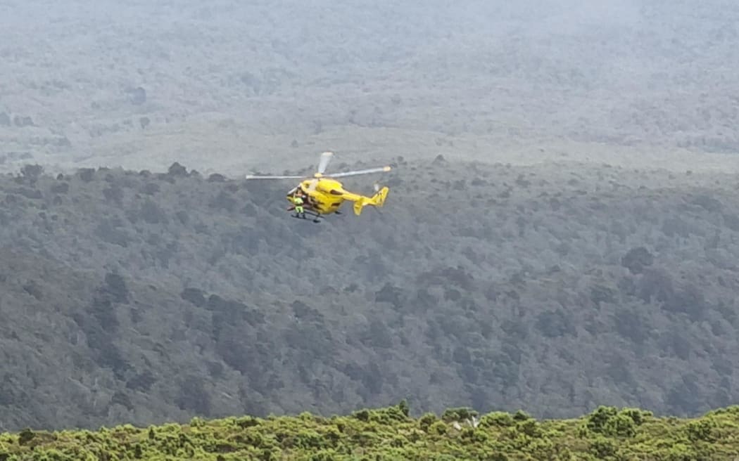 The Taranaki rescue helicopter picking up an injured walker from the Mangorei Track - which heads up to Pouakai Hut and the Pouakai Tarns in Egmont National Park on 2 January, 2024.