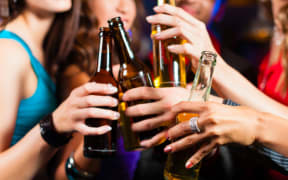 Women in a bar with beers