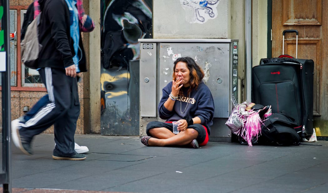 A woman begging in central Auckland.