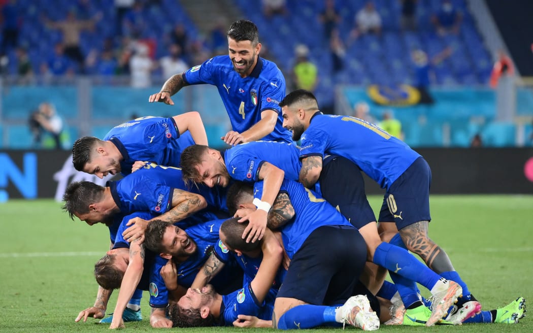Italian footballers celebrate a goal at European Championship.