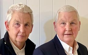 Methven's Dame Lynda Topp (right), pictured with twin sister, Dame Jools, remains committed to her local government election campaign despite setbacks in her cancer treatment.