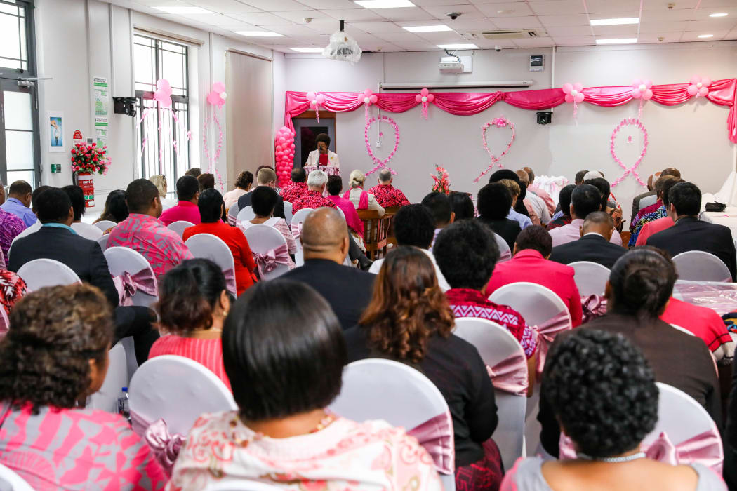Fiji MP Ro Teimumu Kepa tells the room the donations box is calling out for yellow notes which is Fiji's $100 note.