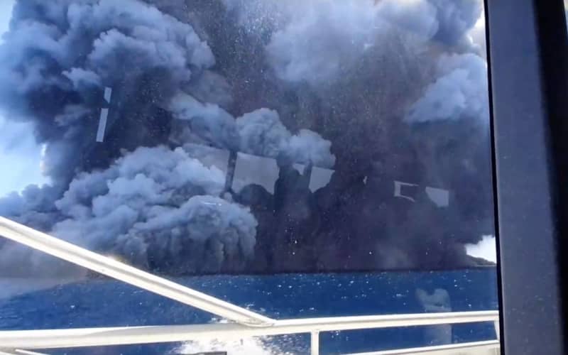 The eruption seen from the tourists’ boat after they had left the island.