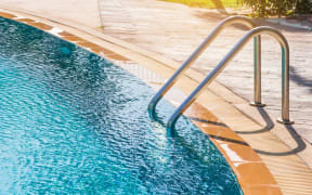 Modern backyard of a swimming pool in public resort or clubhouse