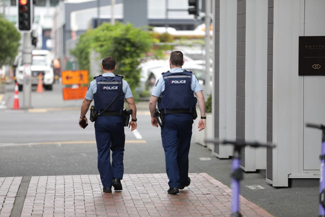 Police officers in Auckland's Viaduct Harbour following an incident at the Sofitel.