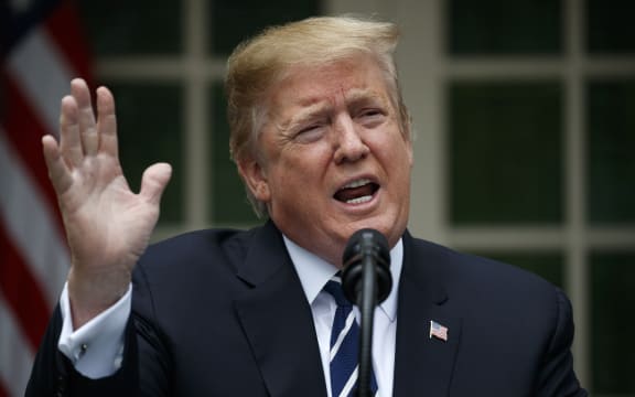 President Donald Trump delivers a statement in the Rose Garden after cutting short a meeting with senior Democrats.