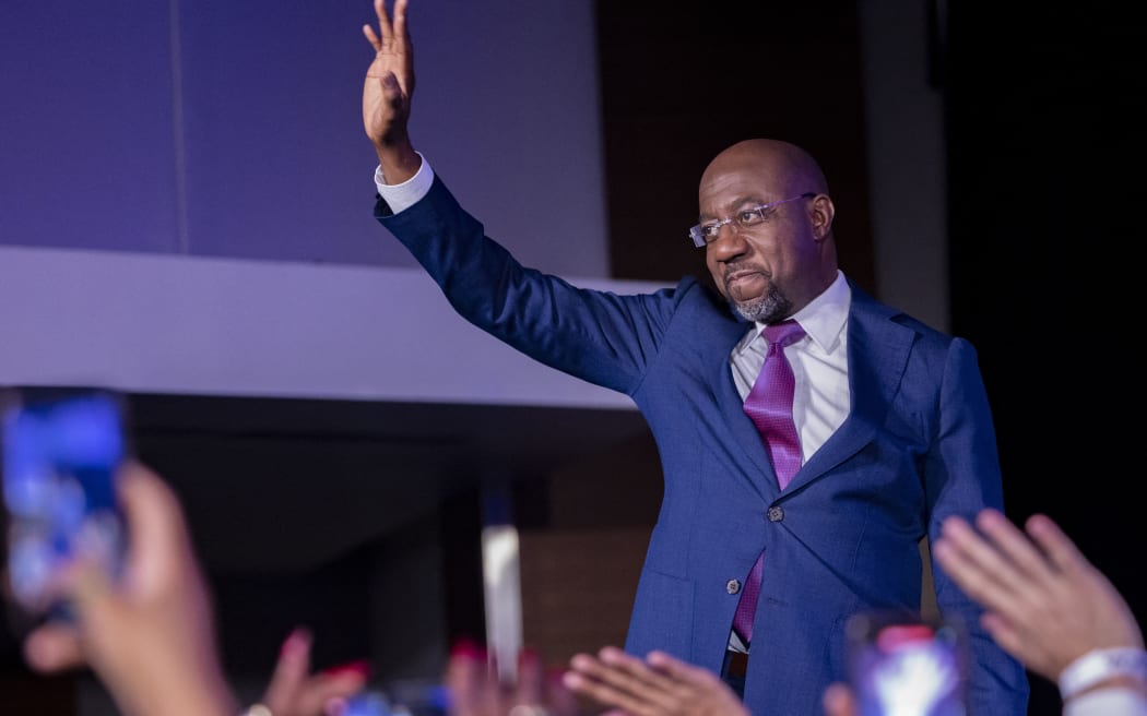 ATLANTA, UNITED STATES - DECEMBER 6: Senator Reverend Raphael Warnock (D-GA) arrives to deliver a victory speech at his election night party in Atlanta, Georgia on December 6th, 2022 following the stateâ€™s Senate runoff election. Nathan Posner / Anadolu Agency (Photo by Nathan Posner / ANADOLU AGENCY / Anadolu Agency via AFP)