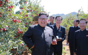 An undated picture released from North Korea's official Korean Central News Agency (KCNA) on September 21 shows North Korean leader Kim Jong-Un visiting a fruit farm at Kwail-ŭp County.