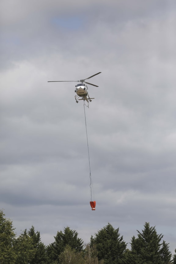 A helicopter at the Nelson fires