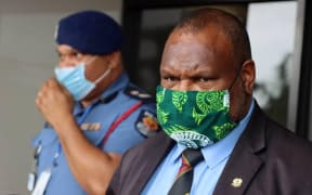 PNG's police commissioner David Manning (left) and prime minister James Marape