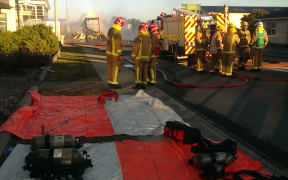 People were evacuated from the immediate area due to the intensity of the blaze.
