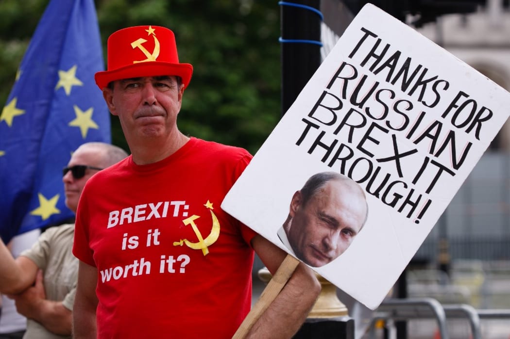 Anti-Brexit activist Steve Bray, wearing a hat and t-shirt featuring a hammer and sickle, demonstrates outside the Houses of Parliament in London, England, on July 22, 2020.
