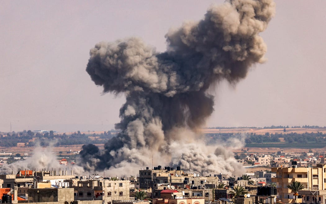 A smoke plume erupts during Israeli bombardment in Rafah in the southern of Gaza Strip on October 19, 2023. Thousands of people, both Israeli and Palestinians have died since October 7, 2023, after Palestinian Hamas militants based in the Gaza Strip, entered southern Israel in a surprise attack leading Israel to declare war on Hamas in Gaza on October 8. (Photo by SAID KHATIB / AFP)