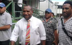Papua New Guinea government MP James Marape outside the national court in Waigani after an electoral petition against him was dismissed.