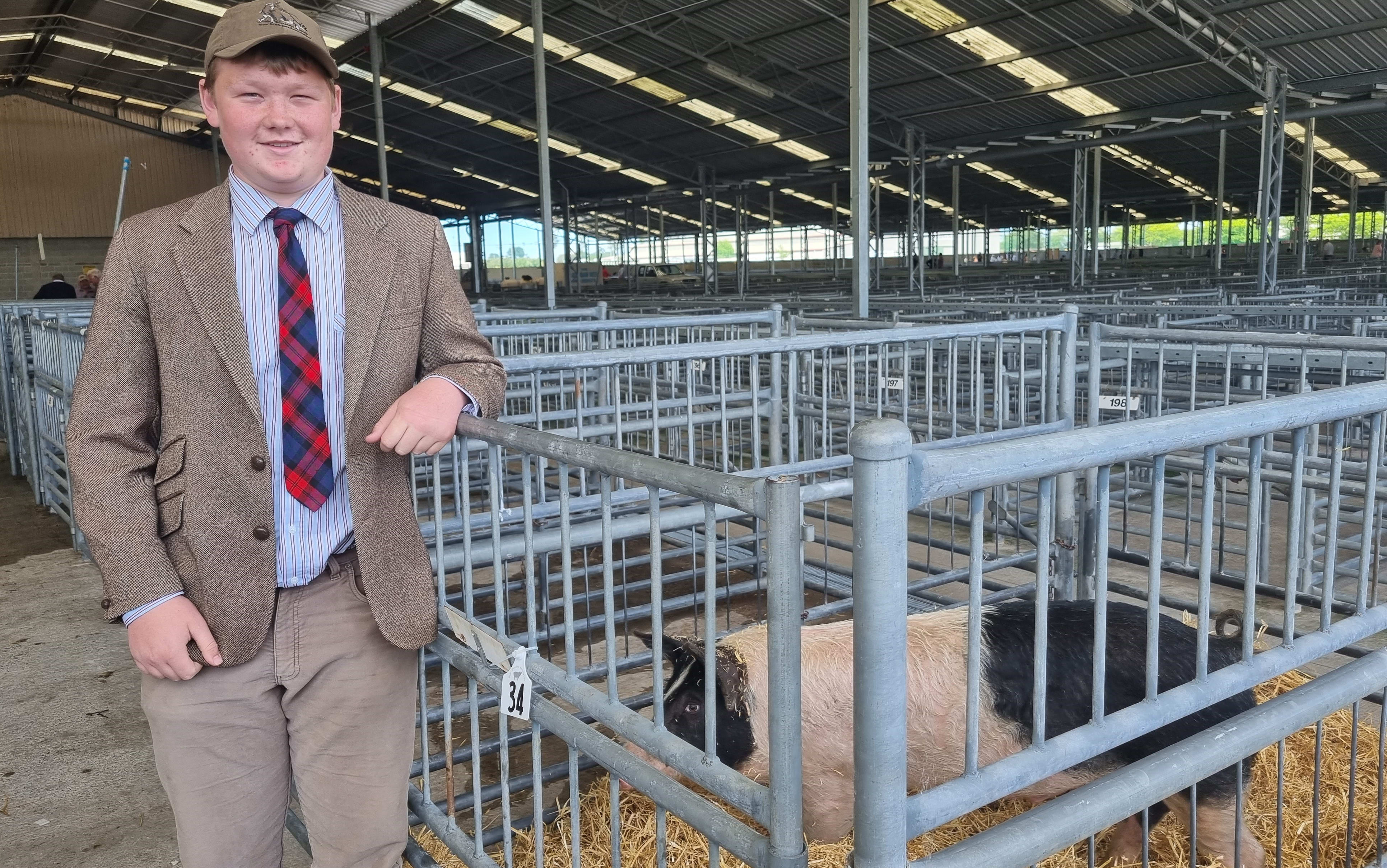 Gus McLachlan, 14, has a pig entered in the pig competition.