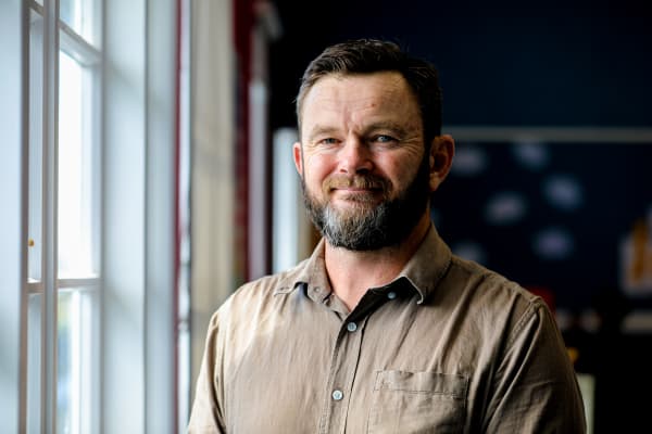Phillip King, a teacher at Oranga School, working in the classroom that he leads with 9 and 10 year old students.