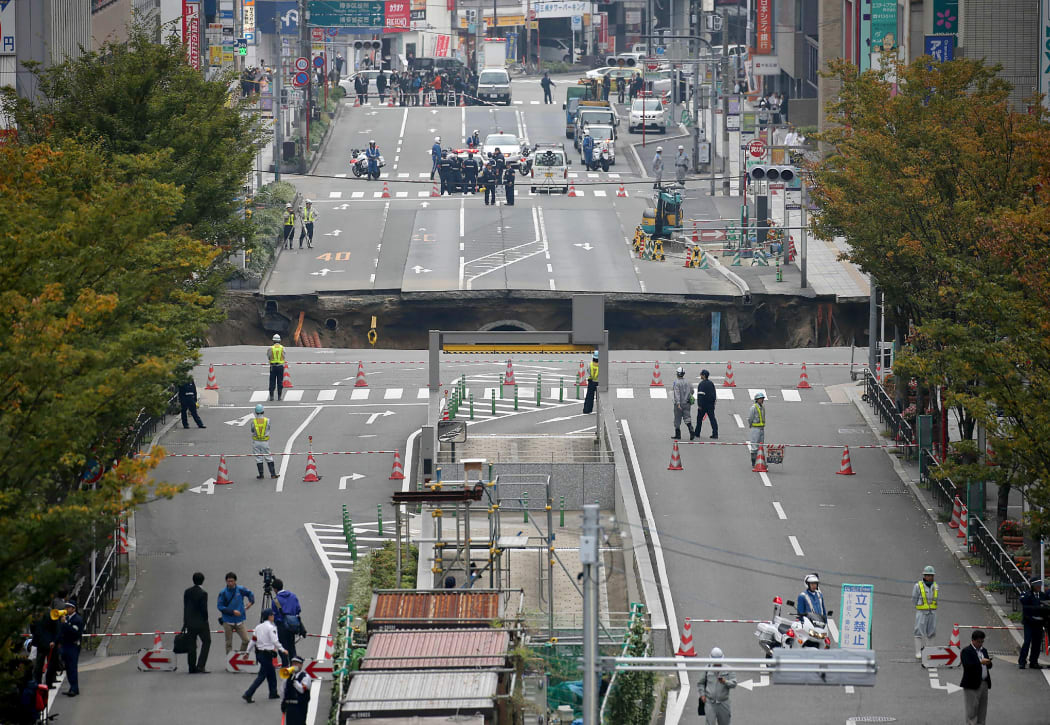A giant sinkhole has swallowed a five-lane street in the centre of Fukuoka, Japan.