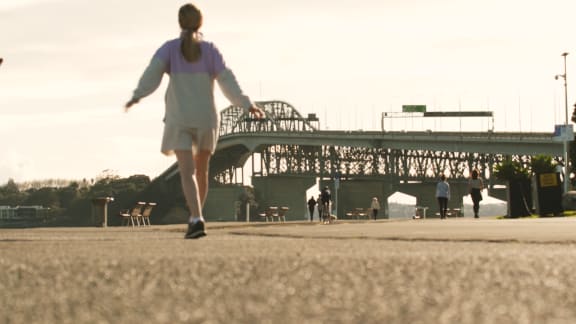 Exercise and social distancing near Auckland's Harbour Bridge during level 4 lockdown.