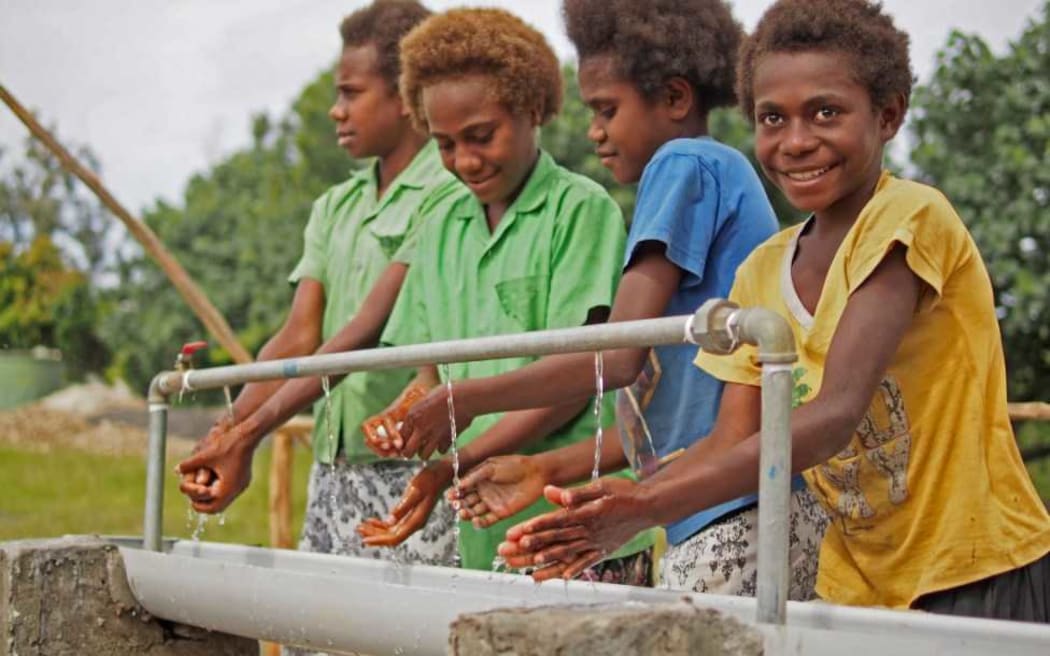 Ni-Vanuatu girls use a new handwashing station