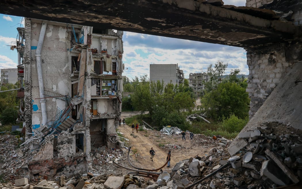 IZYUM CITY, KHARKIV REGION, UKRAINE - SEPTEMBER 19: A view of destruction in the Izyum city, Kharkiv region, Ukraine, on September 19, 2022. The city was destroyed by Russian attacks and was recaptured by the Ukrainian forces on September 10 of this year. Sofia Bobok / Anadolu Agency (Photo by SOFIA BOBOK / ANADOLU AGENCY / Anadolu Agency via AFP)