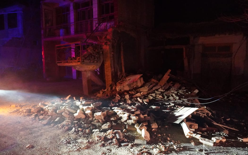 (231219) -- JISHISHAN, Dec. 19, 2023 (Xinhua) -- This photo taken on Dec. 19, 2023 shows houses damaged by earthquake at Chenjia Village in Jishishan Bao'an, Dongxiang, Sala Autonomous County in Linxia Hui Autonomous Prefecture, northwest China's Gansu Province. The 6.2-magnitude earthquake that jolted an ethnic county in northwest China's Gansu Province midnight Monday has killed 111 people in Gansu and neighboring Qinghai Province, according to local earthquake relief headquarters.
  The provincial fire and rescue department has sent 580 rescuers aided with 88 fire engines, 12 search and rescue dogs, more than 10,000 sets of equipment to the disaster area. (Xinhua/Ma Xiping) (Photo by Ma Xiping / XINHUA / Xinhua via AFP)