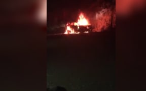 A car belonging to a refugee was set alight by unidentified locals in Nibok following an early morning attack on converted shipping containers housing refugees.