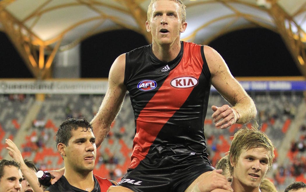 Essendon veteran Dustin Fletcher is carried for the field after playing his 350th game for Essendon during the controversial 2012 season.