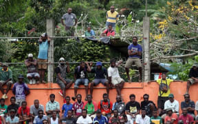Vanuatu football fans find a vantage point in Port Vila.