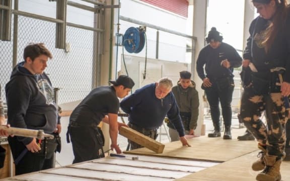 A tutor teaching trades students at UCOL polytechnic, in the lower North Island.