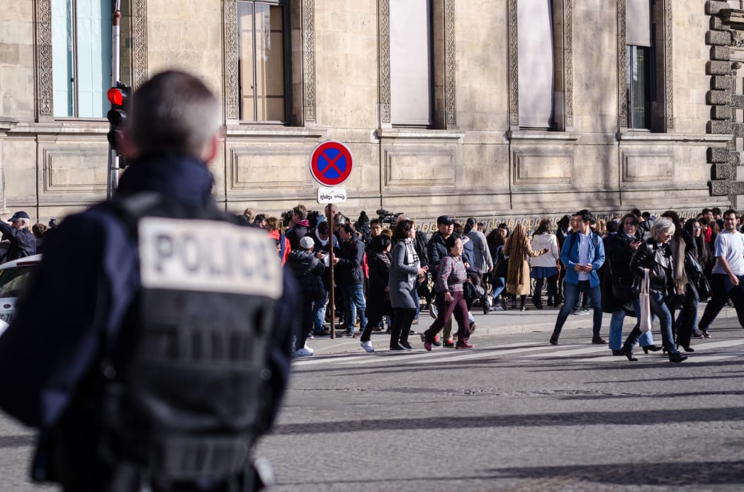 Police secure the area in front of the Louvre, 3 February 2017