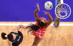 Bailey Mes of New Zealand (left) competes for the ball with Geva Mentor of England during the 1st semi-final in the Netball World Cup at Allphones Arena in Sydney.