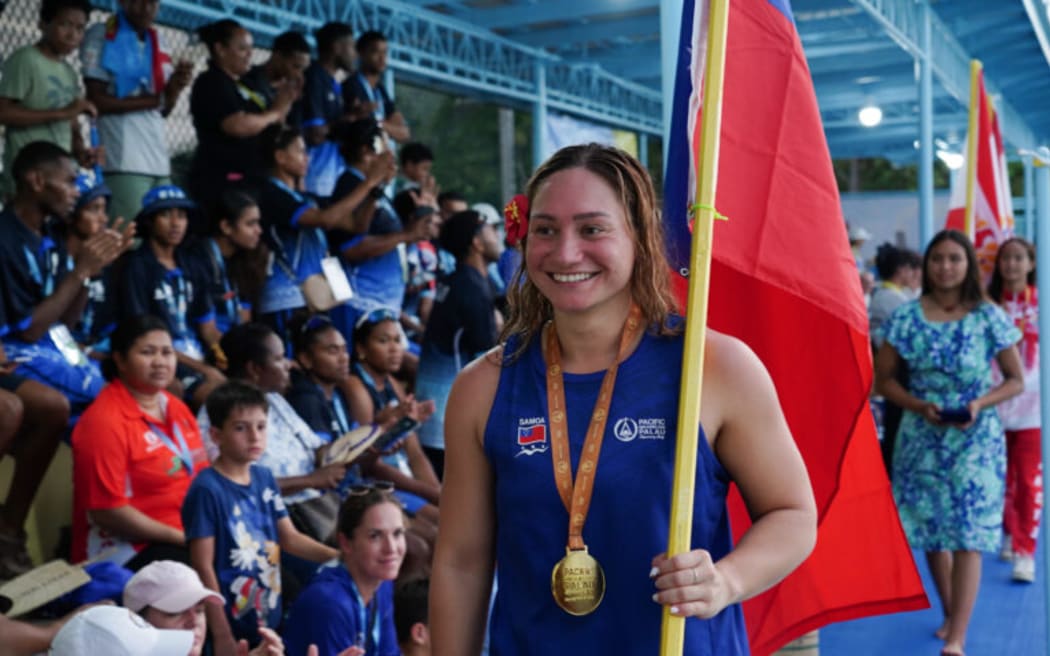 Samoa's Paige Schendelaar-Kemp claimed gold in the women's 100m freestyle in a time of 57.84 seconds.