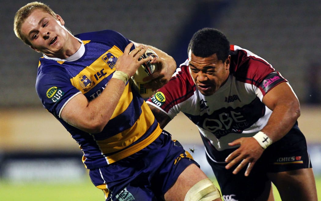 Taione Vea lines up future All Black flanker Sam Cane while playing for North Harbour in 2011.