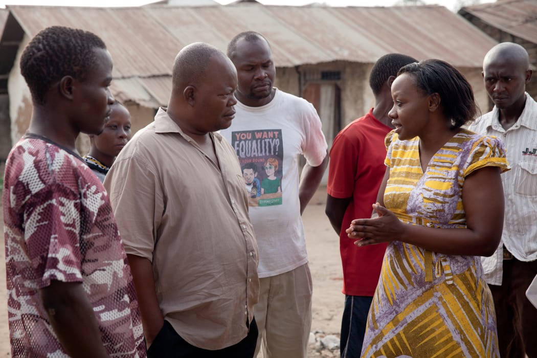Phyllis Omido meeting with community members and former factory workers of Owino Uhuru.