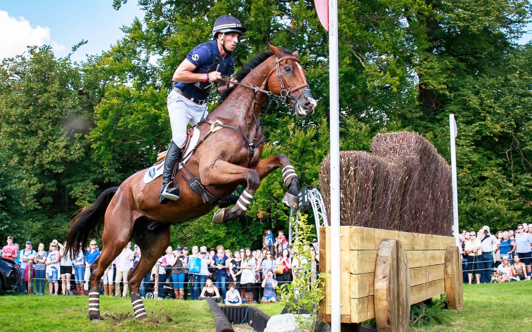 Tim Price and Ringwood Sky Boy compete in the cross-country phase of Burghley.