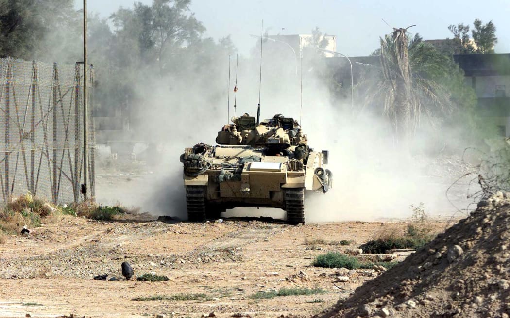 British Desert Rats drive their Warrior tank into the north of Basra, Iraq, 06 April 2003.