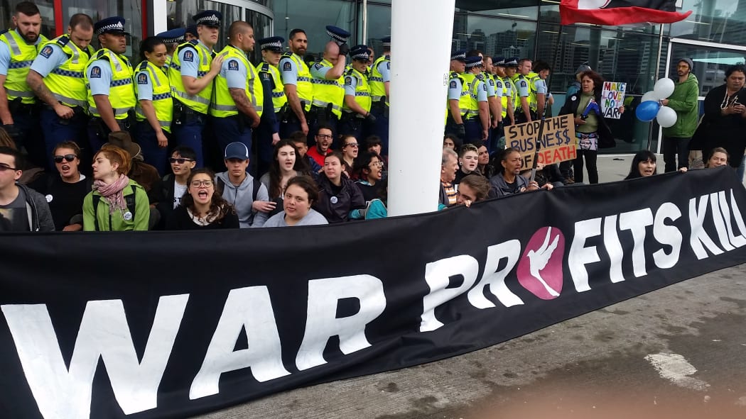 Protesters outside the annual conference of the New Zealand Defence Industry Association.
