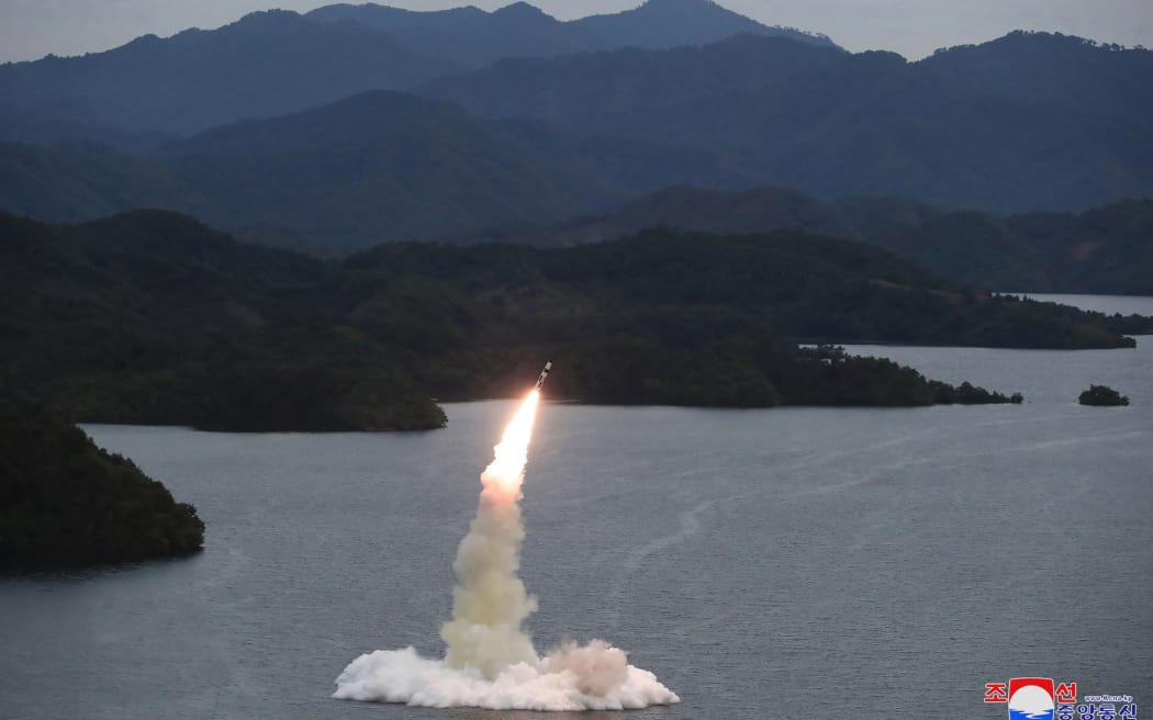 This undated picture released from North Korea's official Korean Central News Agency (KCNA) on 10 October, 2022 shows a Hokkaido missile launch training test by the Korean People's Army Tactical Nuclear Operation Unit at an undisclosed location.