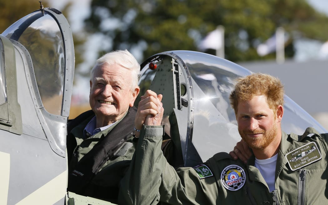 Britain's Prince Harry poses with World War II veteran Tom Neill after he flew in a Spitfire during a Battle of Britain display at Goodwood Aerodrome.